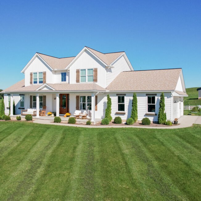 White farmhouse with board and batten siding