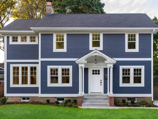 Two-story home with blue fiber cement lap siding and white trim