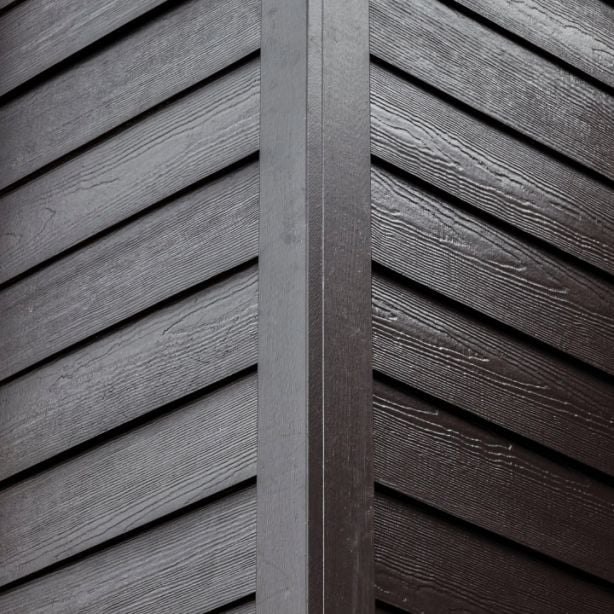 Dark lap siding profile with corner trim